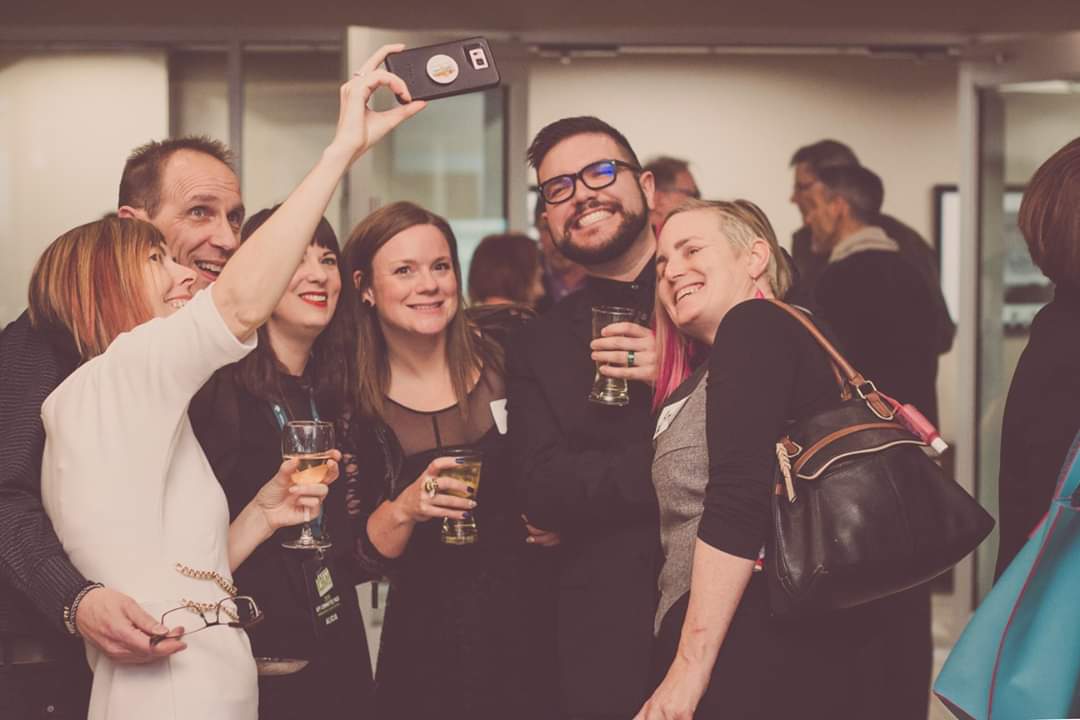 People celebrating at KFF social event