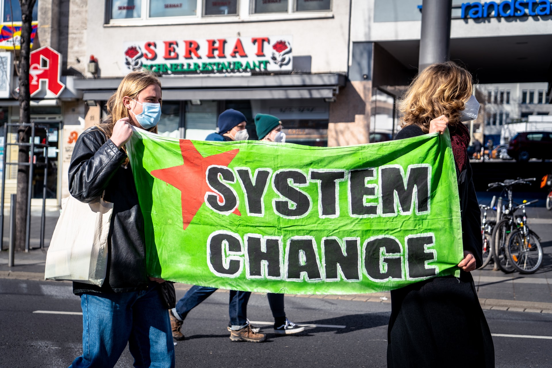 Two people protesting with banner.
