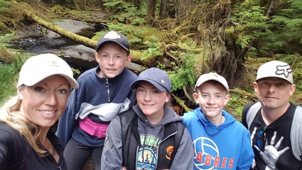 Family selfie in a mossy forest