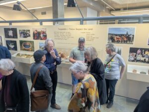Group standing near gallery exhibit